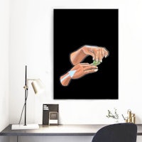 a hand holding a piece of paper on a black background