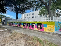 a colorful mural painted on the side of a building
