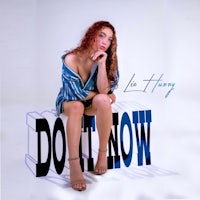 a woman in a blue dress sitting on a box with the words don't now