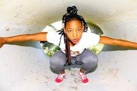 a young woman posing in a pipe