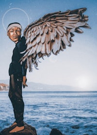 a cartoon of a man with wings standing on rocks near the ocean