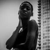 a black and white photo of a woman in a swimsuit