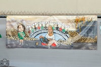 a painting of a woman and a man on a fence
